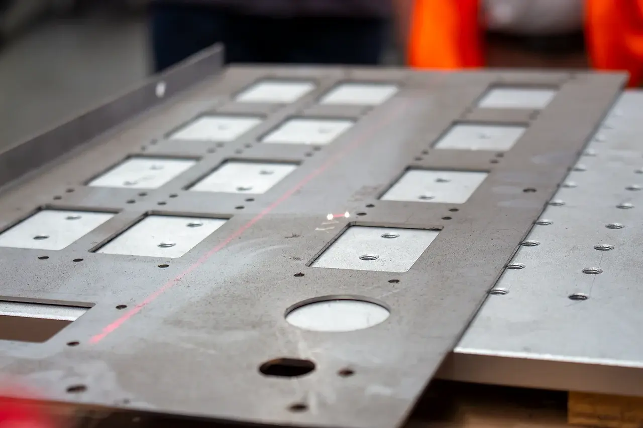 A close view of the marking laser line crossing a fabricated steel panel